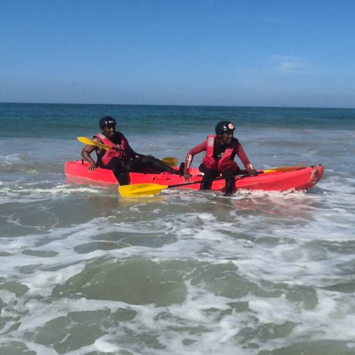 Image of two people on a kayak in the ocean